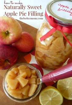 apples and lemons are sitting on a cutting board next to a jar of apple pie filling