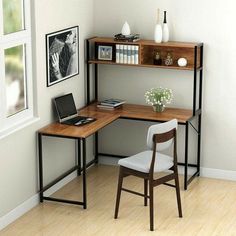 a corner desk with a laptop on it and a chair in front of the desk