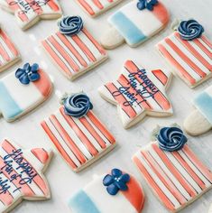 decorated cookies are arranged in the shape of american flags