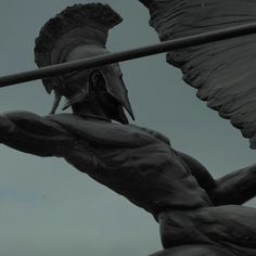 a statue of a man with wings on his back