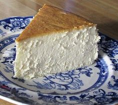 a piece of cheesecake on a blue and white plate