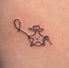 a small star with a hat and a string attached to it's side ribcage