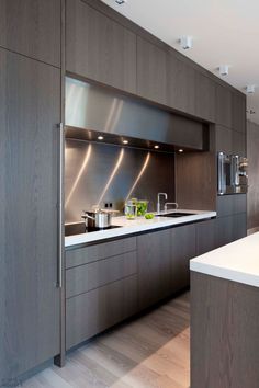 an instagram photo of a kitchen with dark wood cabinets