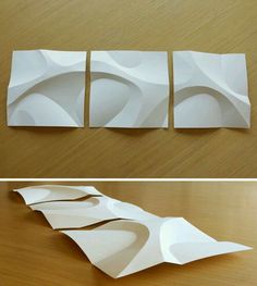 three pieces of paper cut out to look like wavy shapes on a table top and below