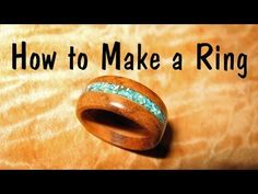a wooden ring sitting on top of a table with the words how to make a ring