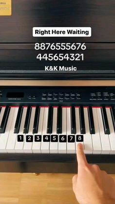a person is playing the piano with their finger on it's keys and numbers