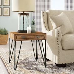 a living room scene with focus on the end table and chair next to the couch