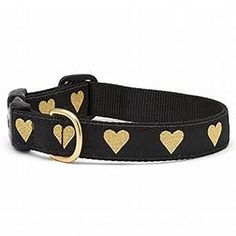 a black collar with gold hearts on it