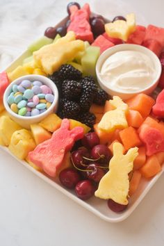 a platter filled with fruit and candy