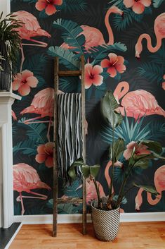 a flamingo wallpaper with pink flowers and palm leaves