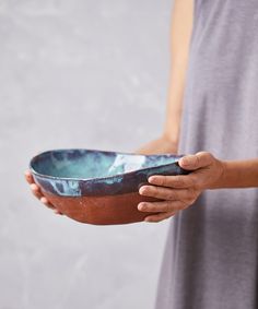a person holding a bowl in their hands