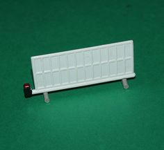a white toy radiator sitting on top of a green floor