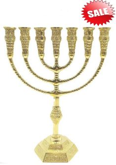 a gold menorah is on sale for $ 5, 99 at the store