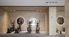 the gym is clean and ready for people to use it as an exercise center in this modern building