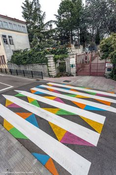 an artisticly painted crosswalk in the middle of a street
