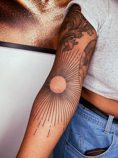 a person with a tattoo on their arm