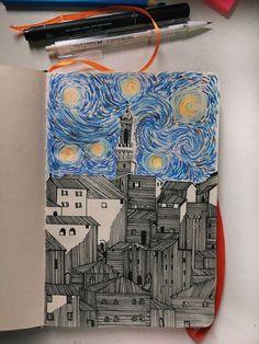 an open notebook with a drawing of a building and starry sky in the background
