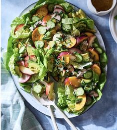 a salad with lettuce, radishes and peaches