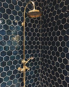 the shower head is gold in color