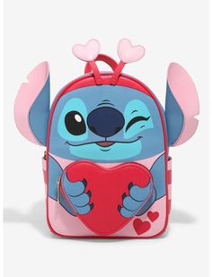 the backpack is shaped like a cartoon character with hearts on its chest and ears, holding a heart