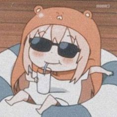 an anime character with sunglasses and a drink in her hand sitting on a bean bag