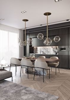 a modern dining room and kitchen area with wood flooring, marble counter tops and pendant lights