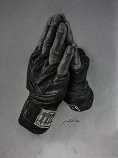 a black and white drawing of a person's hand holding a pair of boxing gloves