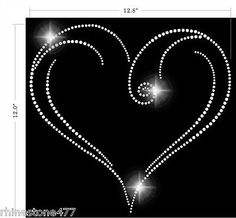 the diamond heart wall sticker is shown in black with white dots and sparkles