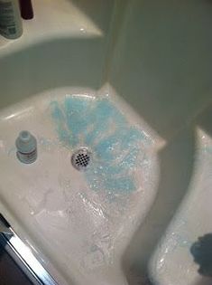 a bathtub with soap and water on it