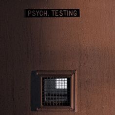 there is a sign on the wall that says psych testing