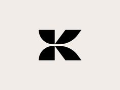 the letter k is made up of two overlapping shapes, one black and one white
