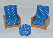 two wooden chairs with blue and white polka dots on them, one has a footstool
