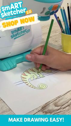 a person is drawing with markers and pencils on a sheet of paper that says smart sketcher 2 0 shop now
