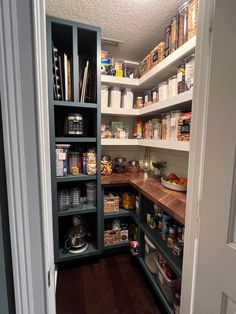 an open pantry with lots of food in it