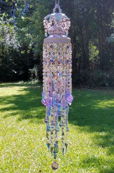 a glass wind chime in the grass