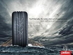 an advertisement featuring two tires floating in the ocean