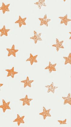an orange and white background with gold stars
