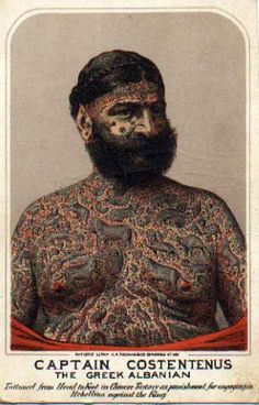 an old photo of a man with tattoos on his chest and arms, in front of a white background