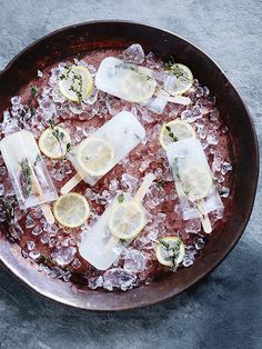 a pan filled with ice and lemon slices