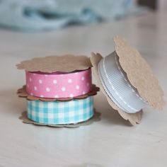 two rolls of washi tape sitting on top of each other next to one another
