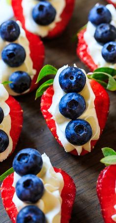strawberries and blueberries are arranged on top of each other