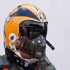 a man wearing a helmet and goggles with his face covered by a protective gear