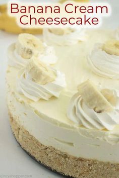 a banana cream cheesecake on a plate with bananas in the background and text overlay