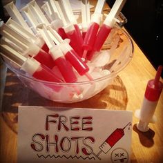 a bowl full of toothbrushes with free shots on it