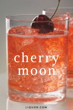 two glasses filled with ice and cherries on top of a white countertop next to the words cherry moon