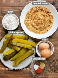 the ingredients to make pickles on a plate are labeled in separate bowls, including flour, seasonings, and eggs