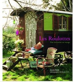 the cover of les roulottes, with chairs and tables in front of it
