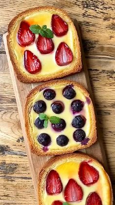 three pieces of bread with fruit on them