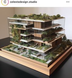 a model of a building with trees on top