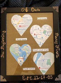 some paper hearts are hanging on a bulletin board with words written in gold and black